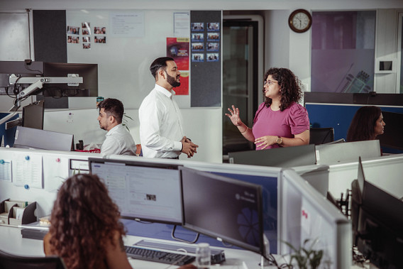 Colleagues working an in a busy office
