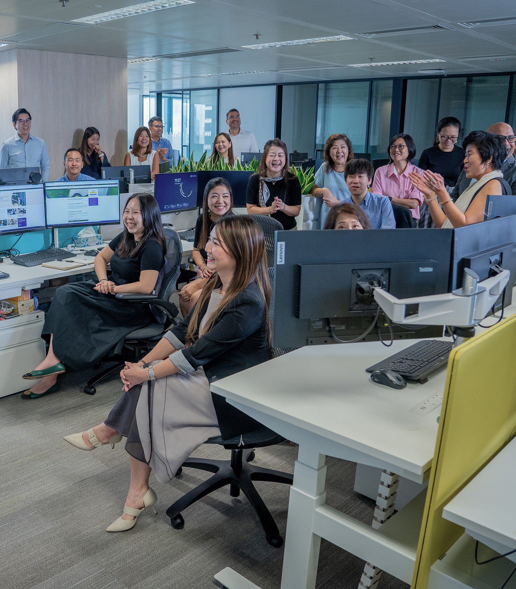 A group of smiling colleagues in an office