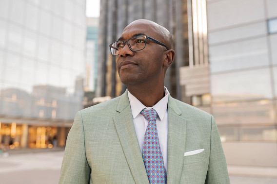 man in suit outdoors in city