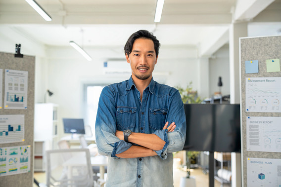 Man looking to camera with arms crossed