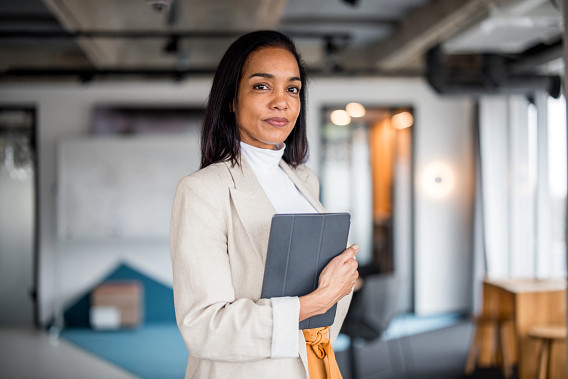 business woman standing proudly